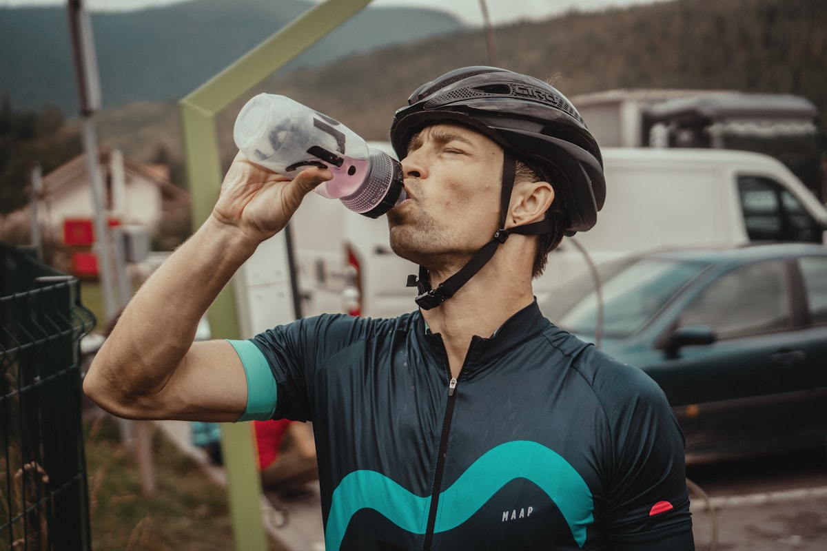 Strength athlete hydrating between sets